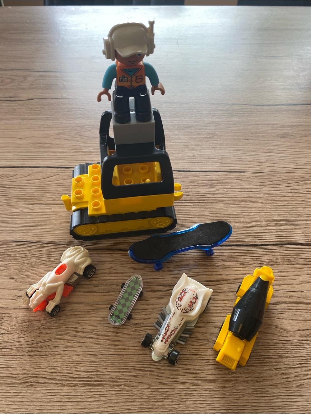 Yellow Construction Ride-On Toy with Mini Vehicles and Figure